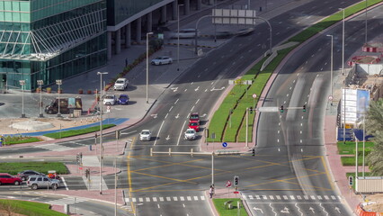 Bussy traffic on the road intersection in Dubai business bay district aerial timelapse, UAE