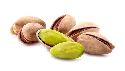 Salted Pistachio nuts in closeup isolated on white background.