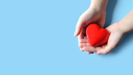 Woman hand holding red heart, World health day, Health care and mental health concept, Health insurance, Charity volunteer donation, CSR responsibility, World heart day