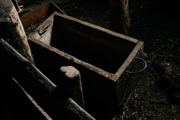 Obraz premium Dilapidated wooden troughs for animal feeding