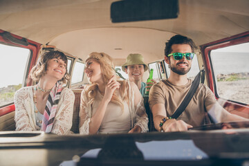 Photo of young cool company drive car on holiday trip wear hippie cloth outside