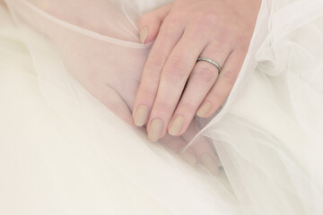 Obraz na płótnie Canvas wedding manicure with false beige matte long nails
