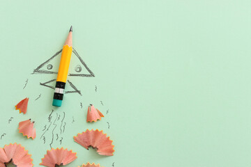 Pencil and rocket sketch over textured paper, concept of back to school, creativity and success