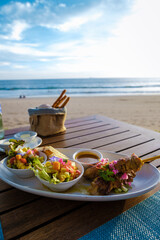 Thai food on a table on the beach in Thailand. table with Thai food Thai sate