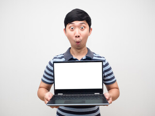 Young man amazed emotion holding laptop white screen isolated