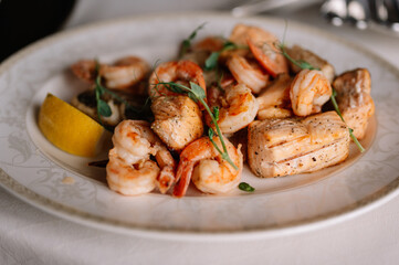 Grilled seafood in teppanyaki style set in iron plate.