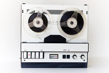 old-style reel-to-reel tape recorder, on a white background
