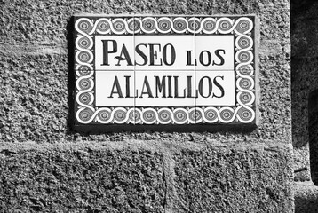 Fototapeta premium Spain - street sign in San Lorenzo de El Escorial. Black white photo vintage style.