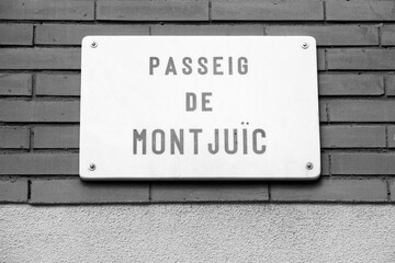 Barcelona street sign - Passeig de Montjuic. Black white photo retro style.