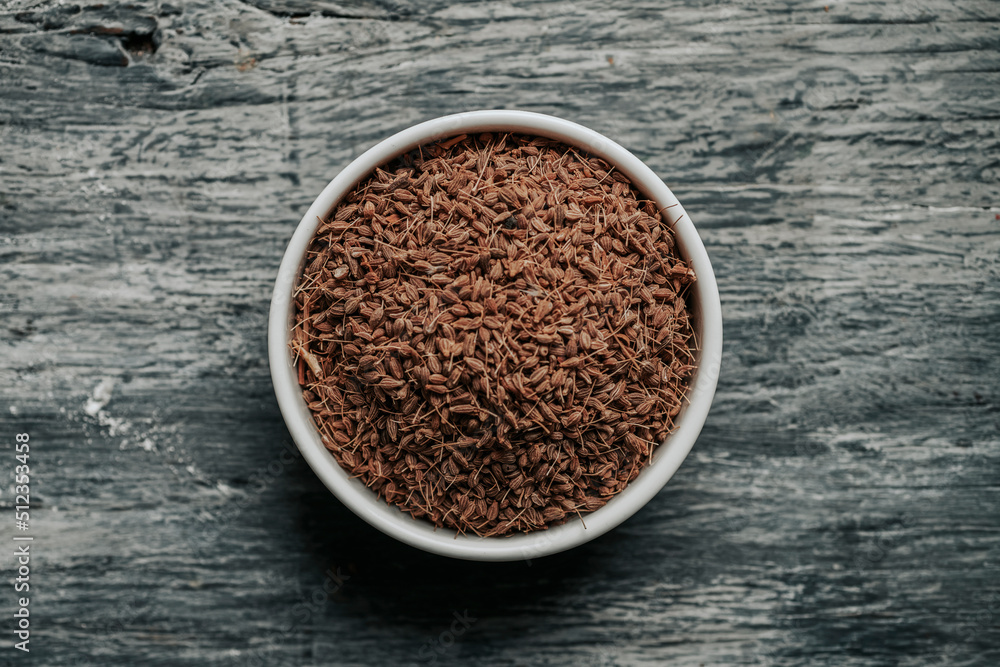 Poster ceramic bowl full of dry anise seeds