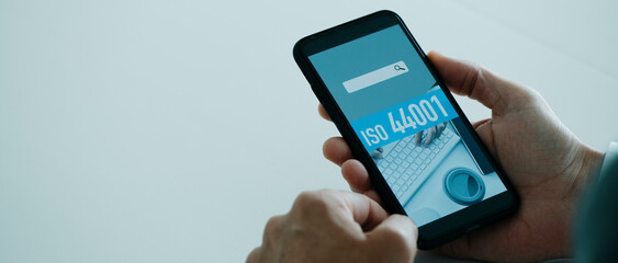 text ISO 44001 in smartphone, web banner