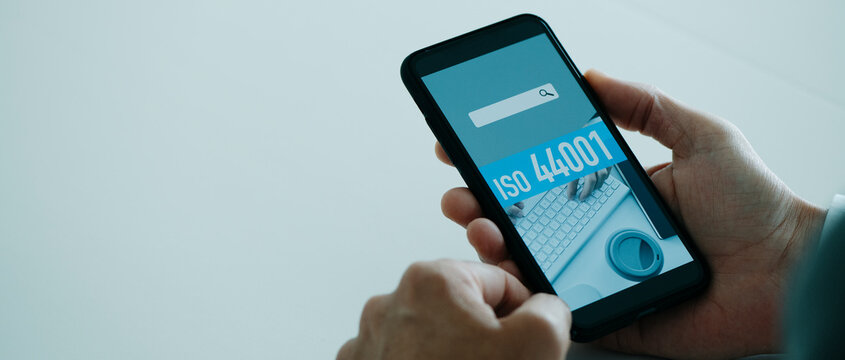 text ISO 44001 in smartphone, web banner