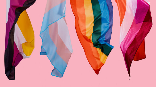 LGBTQIA pride flags on a pink background