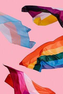 different LGBTQIA pride flags waving