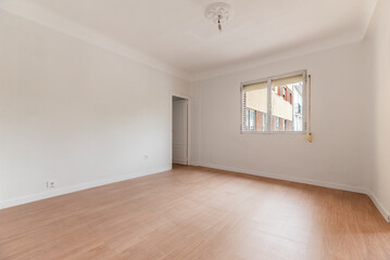 Empty living room with white painted walls with wooden window and light oak floorboards