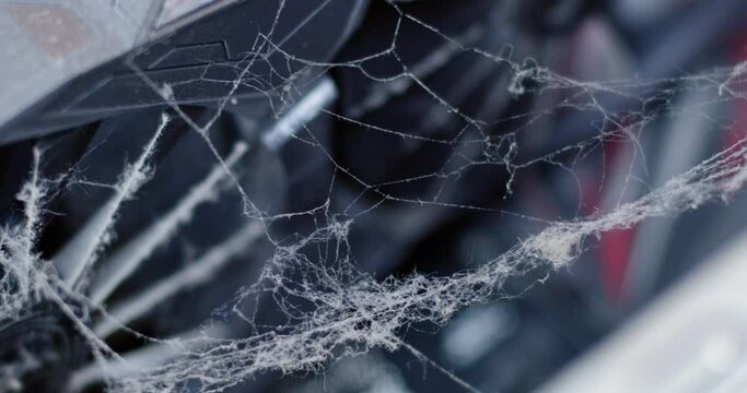 Cobwebs and dust sway in the wind in a computer case against the backdrop of fan blades. Dust in the computer case.