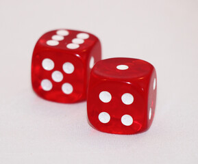 two red dice with number six and one