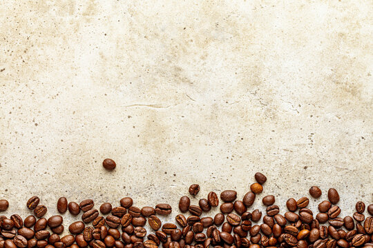 Light grunge coffee background with stone texture. Copy space, top view
