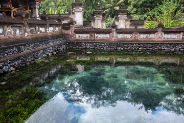 Fototapeta na wymiar Tirta Empul Temple, is a Hindu Balinese water temple It's famous for holy water where Hindu people go for purification in Bali, Indonesia