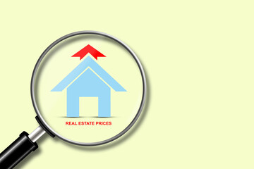 Rising property prices. Icon of house, and arrow up, on a yellow background.Magnifying glass.Copy space. World crisis. Business.