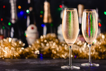 Champagne glasses on a dark background.