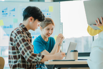 a group of successful business people in the conference room Asia Youth Team Startup Ideas: Meet young entrepreneurs brainstorm business plans and share ideas in a workshop.