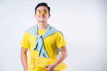 Portrait of young Asian man on background