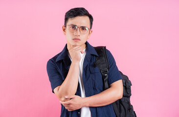 Fototapeta premium Image of young Asian college student on pink background