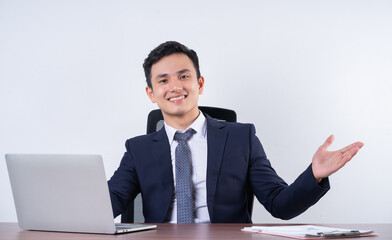Image of young Asian businessman on background