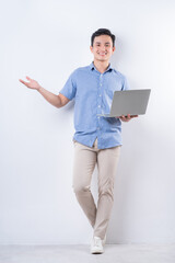 Full length image of young Asian man on white background