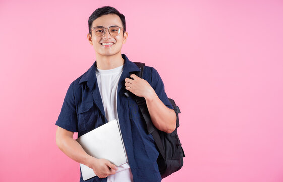 Image of young Asian college student on pink background