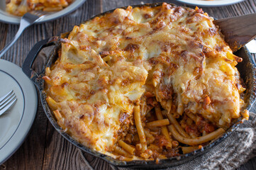 Macaroni casserole with mozzarella cheese topping. Cooked with bolognese and bechamel sauce