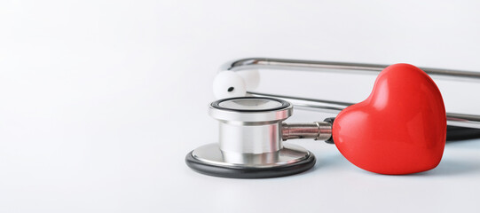 Red heart and stethoscope. Cardiology, heart health and care concept