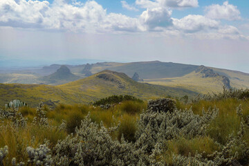 Scenic view of rock formations against a mountain background at Ol Doinyo Lesatima Dragons Teeth in the Aberdares, Kenya