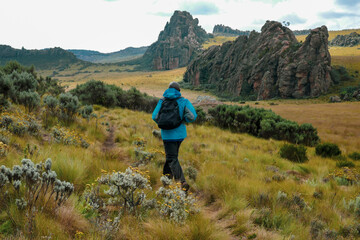 Fototapeta premium View of a man against mountains at Ol Doinyo Lestima Dragons Teeth in the Aberdares, Kenya