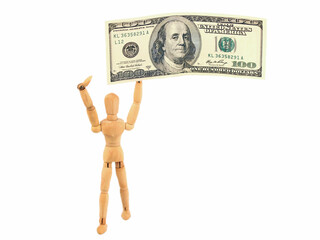 One hundred us dollars banknotes and wooden man