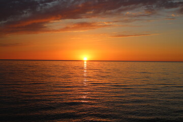 Naklejka na ściany i meble View of beautiful sunset at the sea.