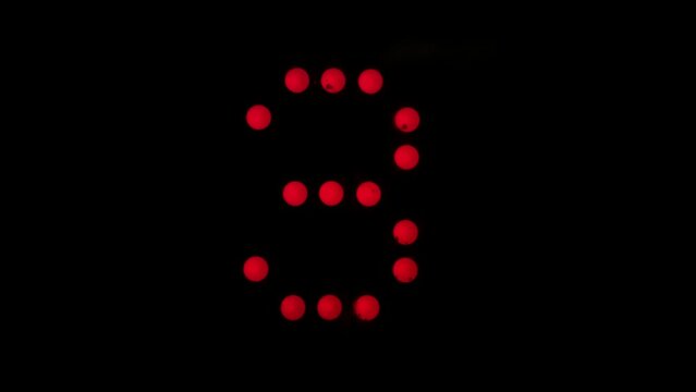 Digital numbers of elevators from 1 to 10, red color on black.