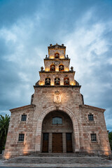 Fototapeta na wymiar facade of a church at dusk with cloudy sky 