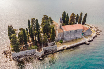 Aerophotography. View from flying drone. St George Island in the Bay of Kotor at Perast in...