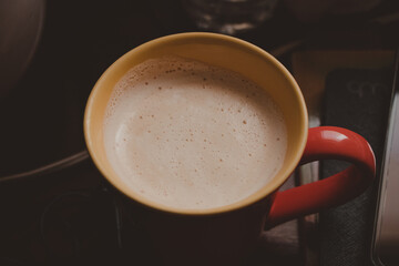 cup of coffee latte on a wooden desk