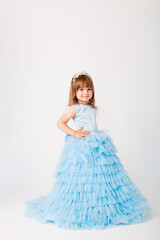 Beautiful little girl in a blue puffy dress