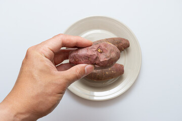 Roasted sweet potatoes on a plate that looks delicious