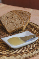 Fototapeta na wymiar bread and honey on a wooden table