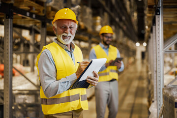 Employees working in large warehouse