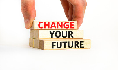 Change your future symbol. Concept words Change your future on wooden blocks on beautiful white table white background. Businessman hand. Business, finacial and change your future concept. Copy space.