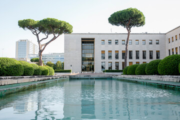 The Fountains Hall a it's business quarter in the Eur district in Rome, Italy. In front of the main...