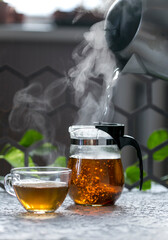 Hot black tea on a dark background 