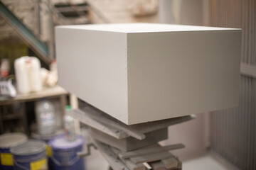 Painting box in gray paint. Painting object in workshop. Wooden box.