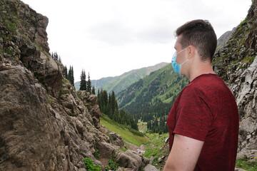 The guy in the mountains takes off his medical mask. Recovery from the coronavirus, the epidemic,...